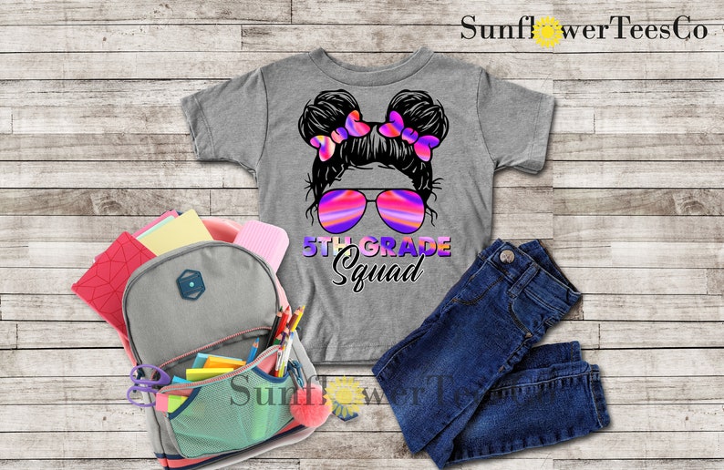 May include: Gray t-shirt with a graphic of a girl with pigtails wearing sunglasses and the text "5th Grade Squad".