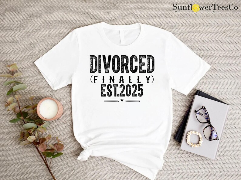 May include: White t-shirt with black text that reads "Divorced (Finally) Est. 2025".