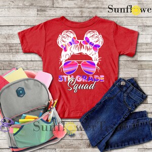 May include: Red t-shirt with a graphic of a girl with pigtails wearing sunglasses and the text "5th Grade Squad".