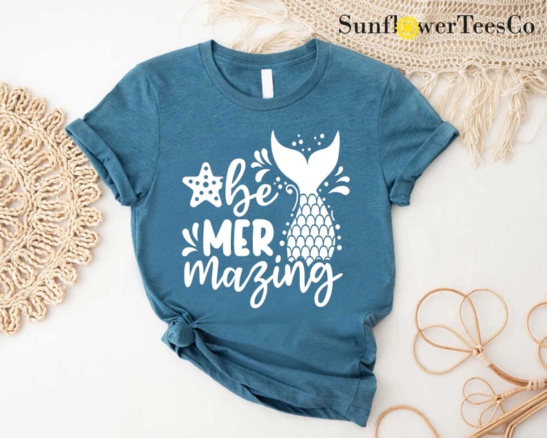 a t - shirt with the words be mermazing printed on it