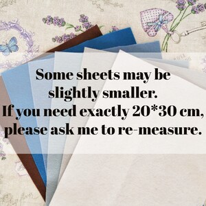 May include: A collection of felt sheets in various shades of blue, brown, and gray. The text on the image states that some sheets may be slightly smaller and requests the customer to ask for re-measurement if they need exactly 20*30 cm.