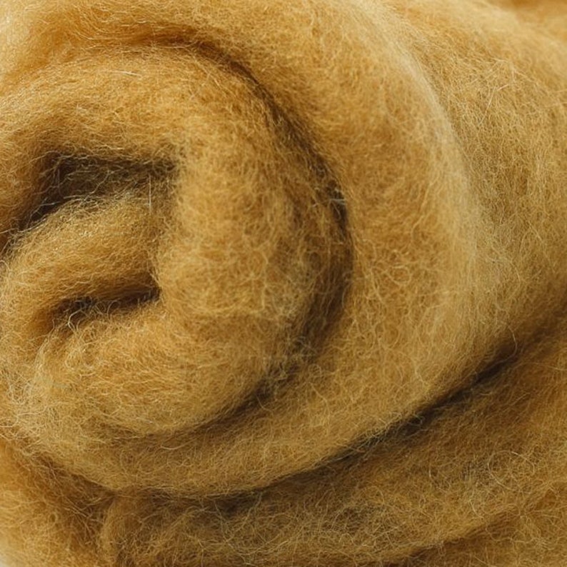 May include: A close-up of a roll of brown wool roving. The wool is soft and fluffy, and it is perfect for felting or spinning.