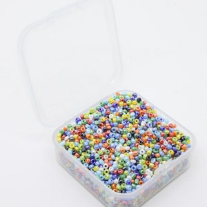 A small box of mixed Opaque Lustre 12/0 2mm Glass Seed Beads. Aprx 3300 beads