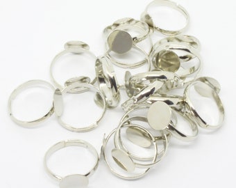 A Pack of 20 Adjustable Platinum colour plated Ring Blank Findings. 10mm Pad. 17mm Dia
