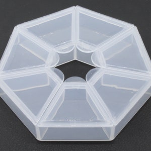 A pack of 4 x 7 compartment, small 8cm storage boxes. for holding beads, jewellery, pills  etc