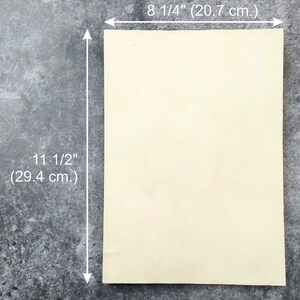 A blank sheet of aged cream-colored paper measuring 8 1/4 inches by 11 1/2 inches.