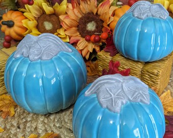 Set of three ceramic pumpkins.