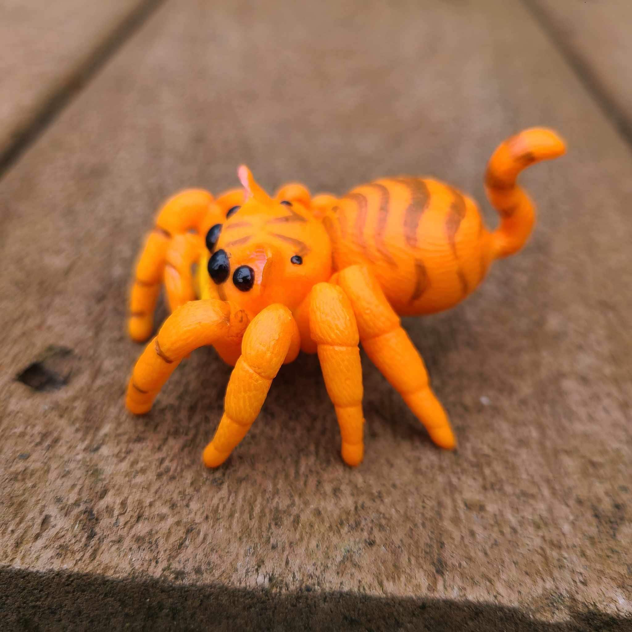 Adorable orange spider, a fun figurine.