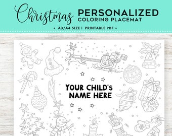 May include: A black and white printable Christmas coloring placemat featuring a variety of holiday images, including a gingerbread man, a reindeer pulling a sleigh, a snowman, a Christmas tree, and a stocking. The placemat also includes the text "YOUR CHILD'S NAME HERE".
