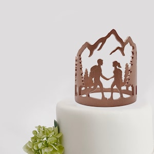 Hiking couple in the mountains wedding cake topper