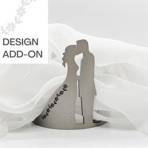 May include: A gray wooden silhouette of a couple kissing, with a floral design on the bride's dress. The silhouette is on a white background.