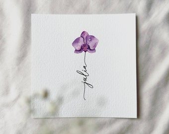 Pode incluir: Uma pintura em aquarela de uma orquídea roxa com o nome "julia" escrito em cursiva abaixo.