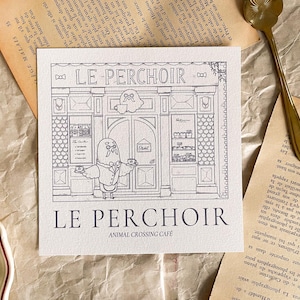 May include: A black and white illustration of a cafe called "Le Perchoir" with an animal crossing character standing in front of the cafe. The text "Animal Crossing Cafe" is below the cafe name.
