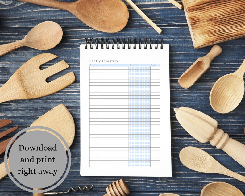 May include: A printable pantry inventory list on a white sheet of paper with blue lines. The paper is in a spiral bound notebook. The notebook is on a blue wooden surface with various wooden kitchen utensils.
