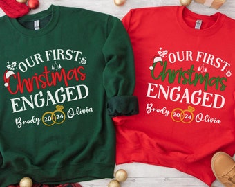 Personalized Our First Christmas Engaged Sweatshirt, New Engaged Couple sweatshirt, Christmas Gift For Newly Engaged Couple, Engagement Gift