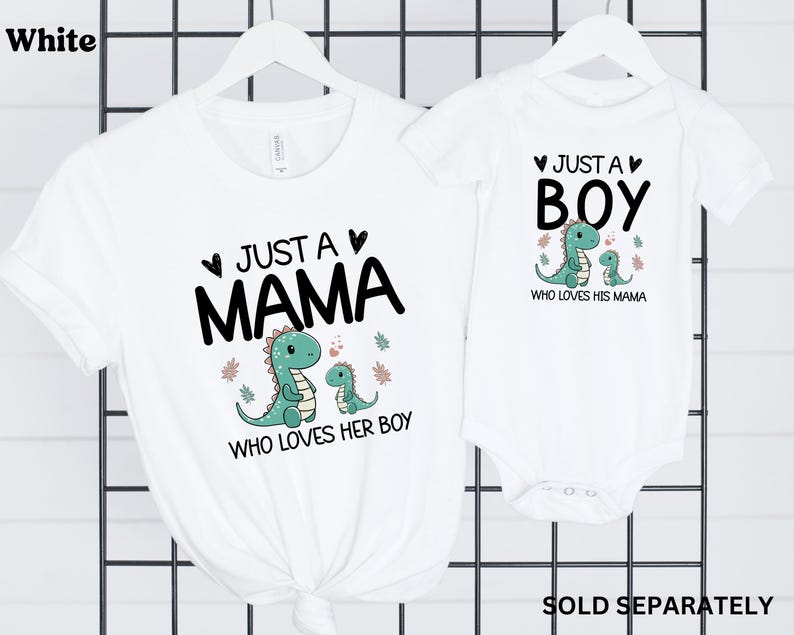 May include: White t-shirts with a dinosaur graphic and text that reads "Just a Mama who loves her boy" and "Just a Boy who loves his mama".