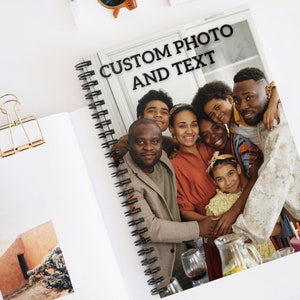 May include: A spiral bound notebook with a photo of a family of seven people smiling and hugging. The text "CUSTOM PHOTO AND TEXT" is printed on the cover.