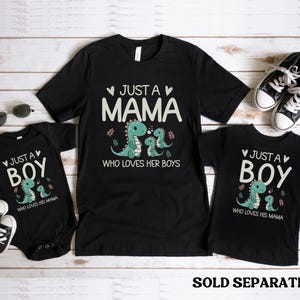 May include: Three black t-shirts with a dinosaur graphic and text that reads "Just a Mama who loves her boys" and "Just a Boy who loves his Mama".
