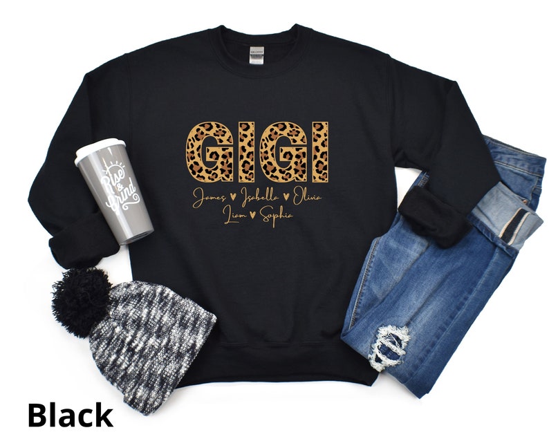 May include: Black sweatshirt with the word "GIGI" in leopard print letters. The names "James, Isabella, Liam, Sophia" are written below the word "GIGI" in a smaller font.