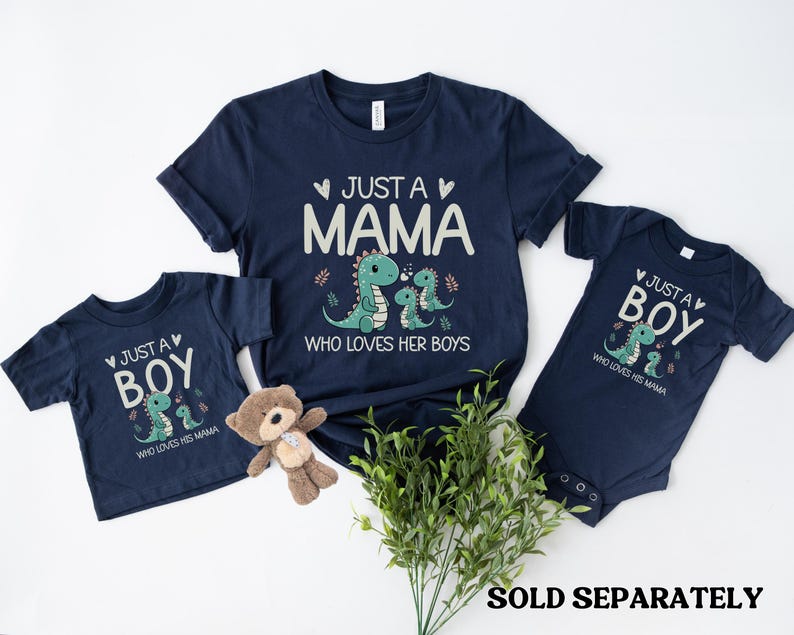 May include: Two navy blue t-shirts with a dinosaur graphic and the text "Just a Mama who loves her boys" and "Just a Boy who loves his Mama".