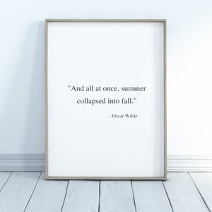 May include: A framed print with a quote by Oscar Wilde: "And all at once, summer collapsed into fall."