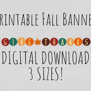 May include: A digital download fall banner with the words "GIVE THANKS" in colourful circles, decorated with autumn leaves. The text "PRINTABLE FALL BANNER" and "DIGITAL DOWNLOAD 3 SIZES!" are also displayed.