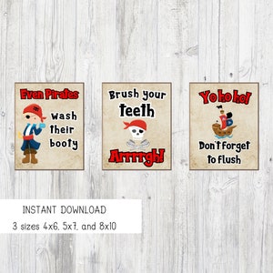 May include: Three printable signs with a pirate theme. The first sign says "Even Pirates Wash Their Booty" and features a cartoon pirate. The second sign says "Brush Your Teeth Arrrrgh!" and features a skull and crossbones. The third sign says "Yohoho! Don't Forget To Flush" and features a cartoon pirate ship.