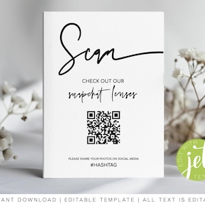 May include: White card with black text that says "Scan" in cursive. Below the text is "Check out our Snapchat lenses" and a black and white QR code. Below the QR code is "Please share your photos on social media #HASHTAG".