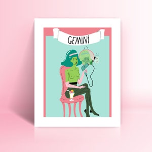 May include: A framed art print depicting a green-skinned figure with teal hair, seated in a pink chair, holding a hair dryer. The word "GEMINI" is on a banner above. The background is light blue with a pink border, and a cocktail is on the left.