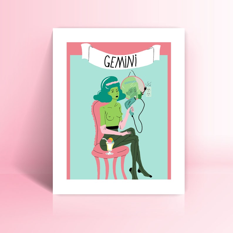 May include: A framed art print depicting a green-skinned figure with teal hair, seated in a pink chair, holding a hair dryer. The word "GEMINI" is on a banner above. The background is light blue with a pink border, and a cocktail is on the left.