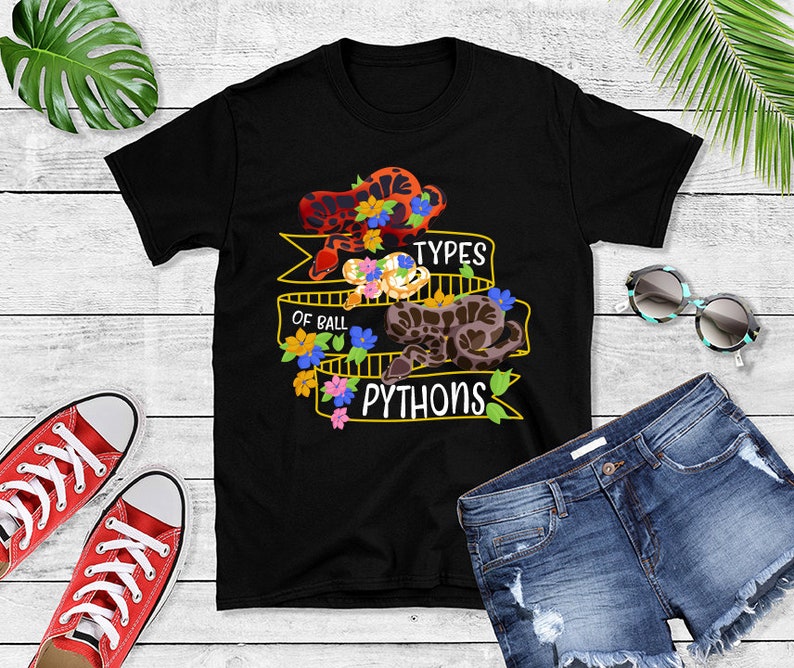 May include: Black t-shirt with a graphic of three ball pythons with flowers and the text "Types of Ball Pythons".