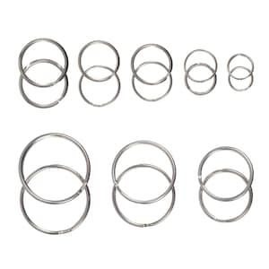 May include: A set of ten silver key rings of varying sizes. The key rings are double looped and are arranged in two rows.