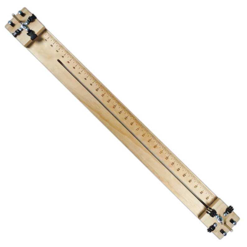 May include: A wooden tool with two adjustable clamps and a ruler marked in inches. The tool is used for stretching and straightening leather straps.