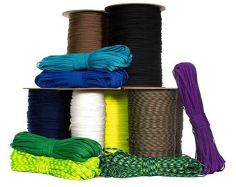 May include: A collection of spools of paracord in various colors, including green, blue, yellow, brown, black, white, and purple. The paracord is wound around spools and stacked on top of each other.