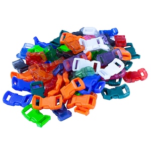 May include: A pile of colorful plastic buckles in various shades of blue, green, orange, red, and white. The buckles are used for attaching straps or cords.