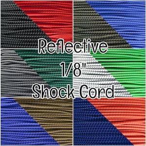 May include: A collage of 1/8 inch reflective shock cord in various colors, including black, red, green, white, blue, orange, brown, and navy blue. The cord is made of a durable material and is perfect for a variety of uses.