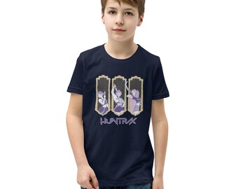 May include: Navy blue t-shirt with a graphic design showing three framed illustrations of figures in action poses. The word "HUNTRAX" is printed below the illustrations in a stylized font. The design uses shades of purple and gold.