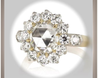 May include: A gold ring with a large, clear, faceted diamond surrounded by a halo of smaller diamonds.