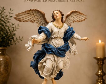 May include: A hand-painted polychrome angel figurine featuring large wings, a white robe, and a flowing blue garment. The text reads THE ANGEL COLLECTION, HAND-PAINTED POLYCHROME ARTWORK, and EXQUISITE DETAIL MADE WITH DEVOTION.