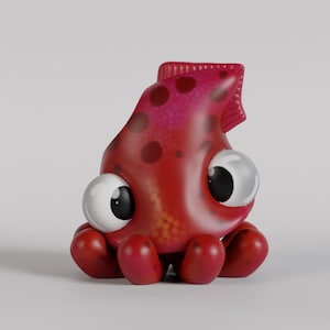 Puede incluir: Una figura de calamar de dibujos animados de color rojo y rosa con ojos grandes y expresivos y un diseño lúdico. El calamar tiene un cuerpo redondeado, tentáculos y una estructura similar a una aleta en la cabeza. La figura está sobre un fondo blanco liso.