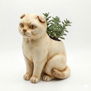 May include: A cream-colored ceramic cat planter with a succulent plant growing from the top. The cat is in a seated position with its tail curled. The planter has detailed facial features and a smooth finish.