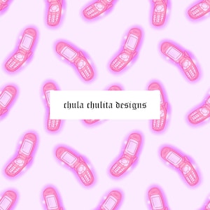 May include: A seamless pattern featuring pink flip phones with a glowing effect on a light pink background. The text "chula chulita designs" is centered on the pattern.