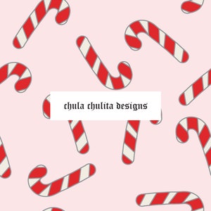 May include: A seamless pattern featuring red and white candy canes on a pink background. The text "chula chulita designs" is in the center of the image.