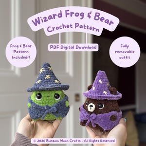 May include: A crochet pattern for a wizard frog and bear, featuring a green frog in a dark blue star-patterned hat and cape, and a brown bear in a purple star-patterned hat and cape. Text includes Wizard Frog & Bear Crochet Pattern, PDF Digital Download, Frog & Bear Pattern Included!!, Fully removable outfit, and 2026 Blossom Moon Crafts - All Rights Reserved.