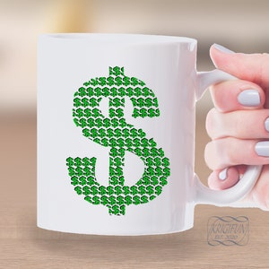 May include: White ceramic mug with a green dollar sign design made up of smaller dollar signs. The mug has a black text at the bottom that reads "KRIGIFUN EST. 2020".