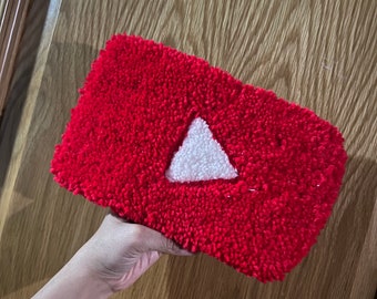 Tufted rug with YouTube logo, red and white triangle - rug making