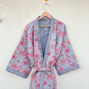 May include: A blue and pink floral patterned robe with a striped lining and a matching tie belt.