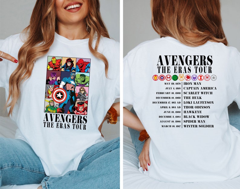 May include: White t-shirt with a graphic of the Avengers characters and the text "Avengers The Eras Tour". The back of the shirt has a list of the Avengers characters and their first appearances.