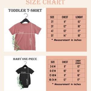 May include: A size chart for a toddler t-shirt and baby one-piece. The toddler t-shirt is mauve, and the baby one-piece is dark gray. Both are on black hangers. Tables list sizes 2T-5T and 3-24 months with chest and length measurements in inches.