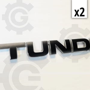 May include: Two black metal "TUNDRA" emblems.